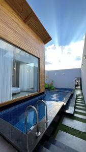 a pool with two faucets in a house at اكواخ سنتارا الريفيه in Taif