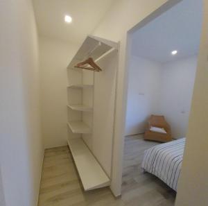 a small bedroom with a closet and a bed at Casa DelFalco in Domodossola