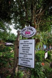 a sign for a garden with a sign for a garden clinic at Hill Station Hostel at Chor Chaba in Ko Kood