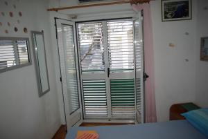 Postel nebo postele na pokoji v ubytování Rooms Tia