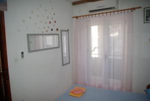 Postel nebo postele na pokoji v ubytování Rooms Tia