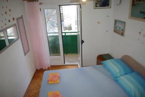 Postel nebo postele na pokoji v ubytování Rooms Tia