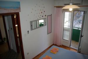 Postel nebo postele na pokoji v ubytování Rooms Tia
