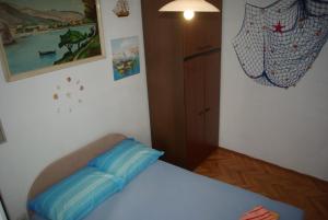Postel nebo postele na pokoji v ubytování Rooms Tia