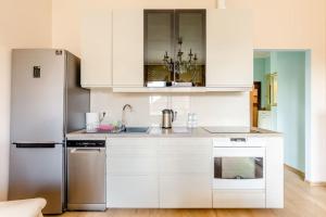 Kuchyňa alebo kuchynka v ubytovaní Deviza Apartments