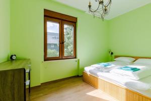 Posteľ alebo postele v izbe v ubytovaní Deviza Apartments