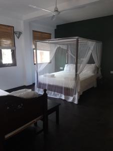 Postel nebo postele na pokoji v ubytování Sunil Garden Guesthouse