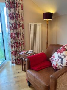 a living room with a couch and a table at The Loft at Pen Orchard in Winscombe