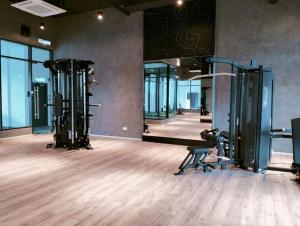 a gym with two tread machines in a room at Onsen Suite at Sunway Lost World Tambun in Ipoh