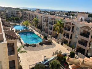 an aerial view of a apartment complex with a swimming pool at Royal Seacrest new apartment B G2 ground floor in Paphos