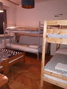 a group of bunk beds in a room at Central Warsaw Apartment in Warsaw