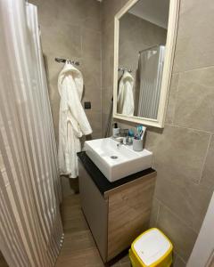 a bathroom with a sink and a mirror at Milmari S50 in Kopaonik