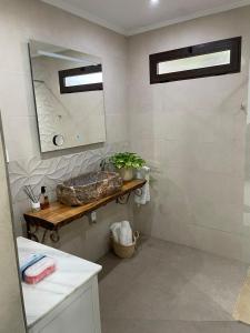 a bathroom with a sink and a mirror at Despertar in Antequera