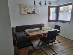 a living room with a table and a couch at Apartment Konrad in Umhausen