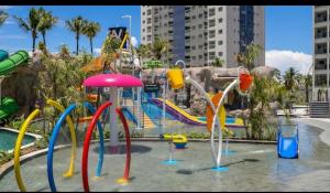 a water park with a playground with a water slide at Salinas Premiun Resort Vista Mar ap1604 in Salinópolis