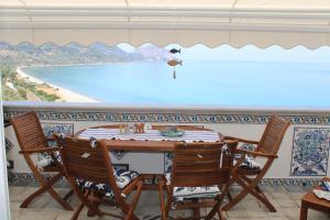 a dining room with a view of the ocean at Cefalù seaside suite in Cefalù