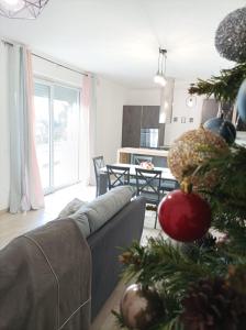 a living room with a christmas tree and a couch at Sweet Home Annalisa in Ortona