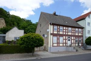 a brown and white building on a street at Roter Hirsch in Oderberg