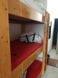 a couple of bunk beds with a bag on them at Les Pioupious de Club Engaly 2 pour 4 personnes in Aragnouet