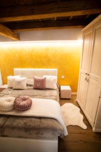 a bedroom with a large bed with pillows on it at The Key Of Bergamo in Bergamo