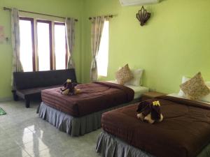 Postel nebo postele na pokoji v ubytování Salatan Resort