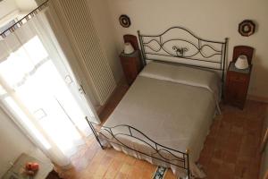 Postel nebo postele na pokoji v ubytování Il Sasso e la Seta
