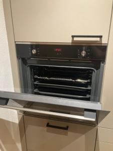 a black oven sitting on top of a counter at Alpenoase Horbergbahn in Schwendau