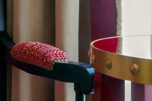 a red bowl with food in it next to a pot at Il Campo Marzio in Rome
