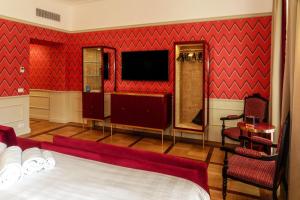 a hotel room with a bed and a television at Il Campo Marzio in Rome