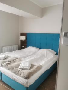 Posteľ alebo postele v izbe v ubytovaní Apartament przy plaży