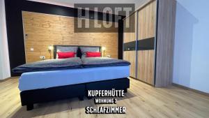 Postel nebo postele na pokoji v ubytování H-Loft Style Apartments