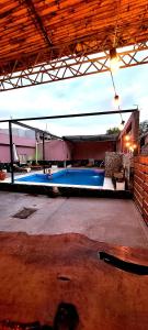 a large swimming pool in a building with a building at Hotel Sante in Tinogasta