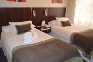 Rúm í herbergi á Hotel Don Eduardo