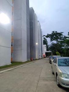 a street with cars parked on the side of a building at SMART Dream Inn in Tangerang