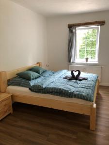 Postel nebo postele na pokoji v ubytování Apartmány Razová - Slezská Harta