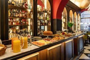 a bar with a buffet of food and drinks at Il Campo Marzio in Rome