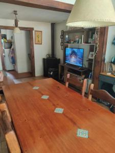 Una televisión o centro de entretenimiento en Casa en Solymar, 2 dormitorios