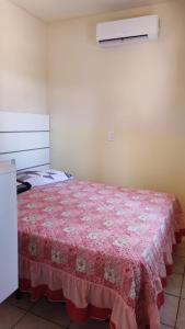 Postelja oz. postelje v sobi nastanitve Apartamentos Azul do Mar Praia da Gamboa Garopaba