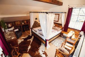 an overhead view of a bedroom with a bed and a window at Šumava Inn in Kvilda