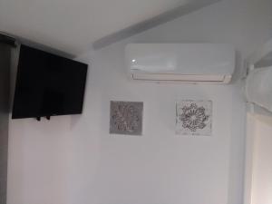 Televízia a/alebo spoločenská miestnosť v ubytovaní HOMELY Duplex Curtidores
