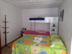a bedroom with a bunk bed in a room at Hospedagem Tia Nena in Pomerode +6 photos