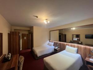 TV o dispositivi per l'intrattenimento presso West County Hotel