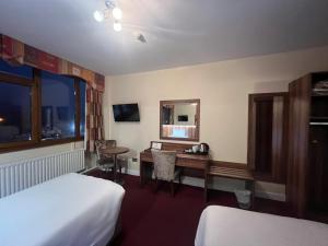 TV o dispositivi per l'intrattenimento presso West County Hotel
