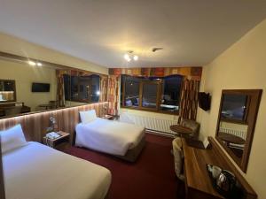 Letto o letti in una camera di West County Hotel