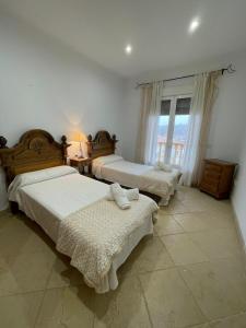 A bed or beds in a room at Casa Gonzalez