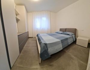 Ένα ή περισσότερα κρεβάτια σε δωμάτιο στο La Casa di Marco