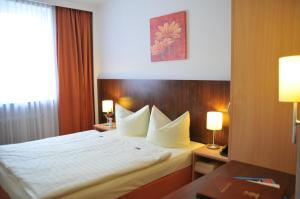 Cama ou camas em um quarto em Hotel Italia