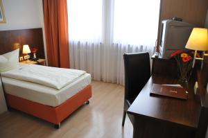 Cama ou camas em um quarto em Hotel Italia