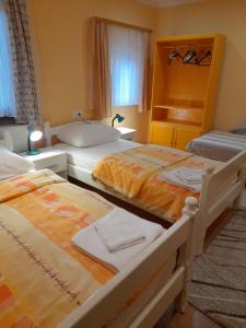 Postel nebo postele na pokoji v ubytování Apartman Peric
