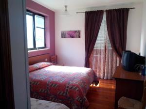 Un pat sau paturi într-o cameră la Hotel Turano